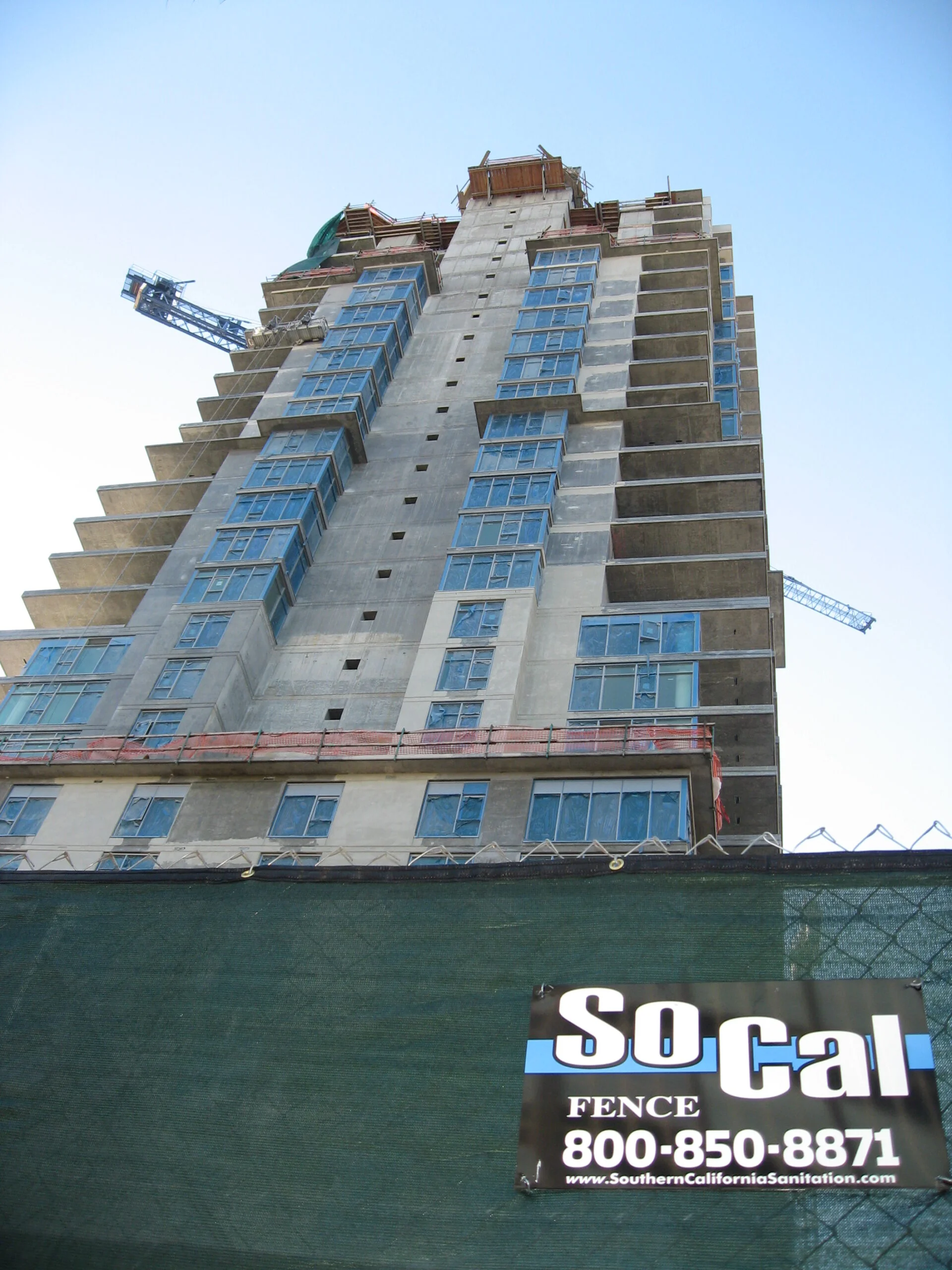 Temporary chain link fence installation at a Los Angeles construction site