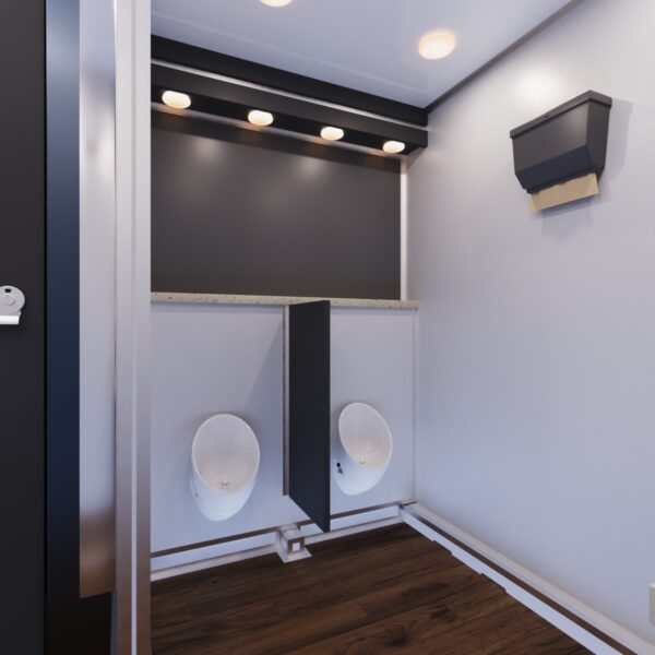A clean and modern dual urinal section in a luxury restroom trailer, featuring privacy partitions.