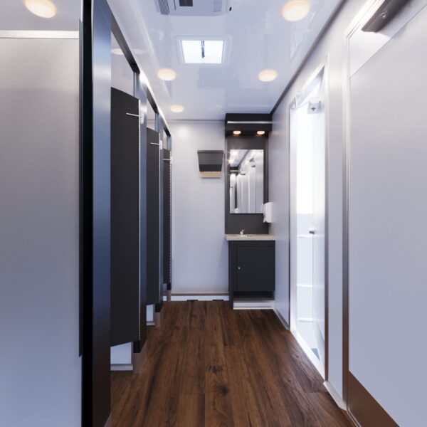 Perspective view of the interior of a luxury restroom trailer with doors open to individual stalls.